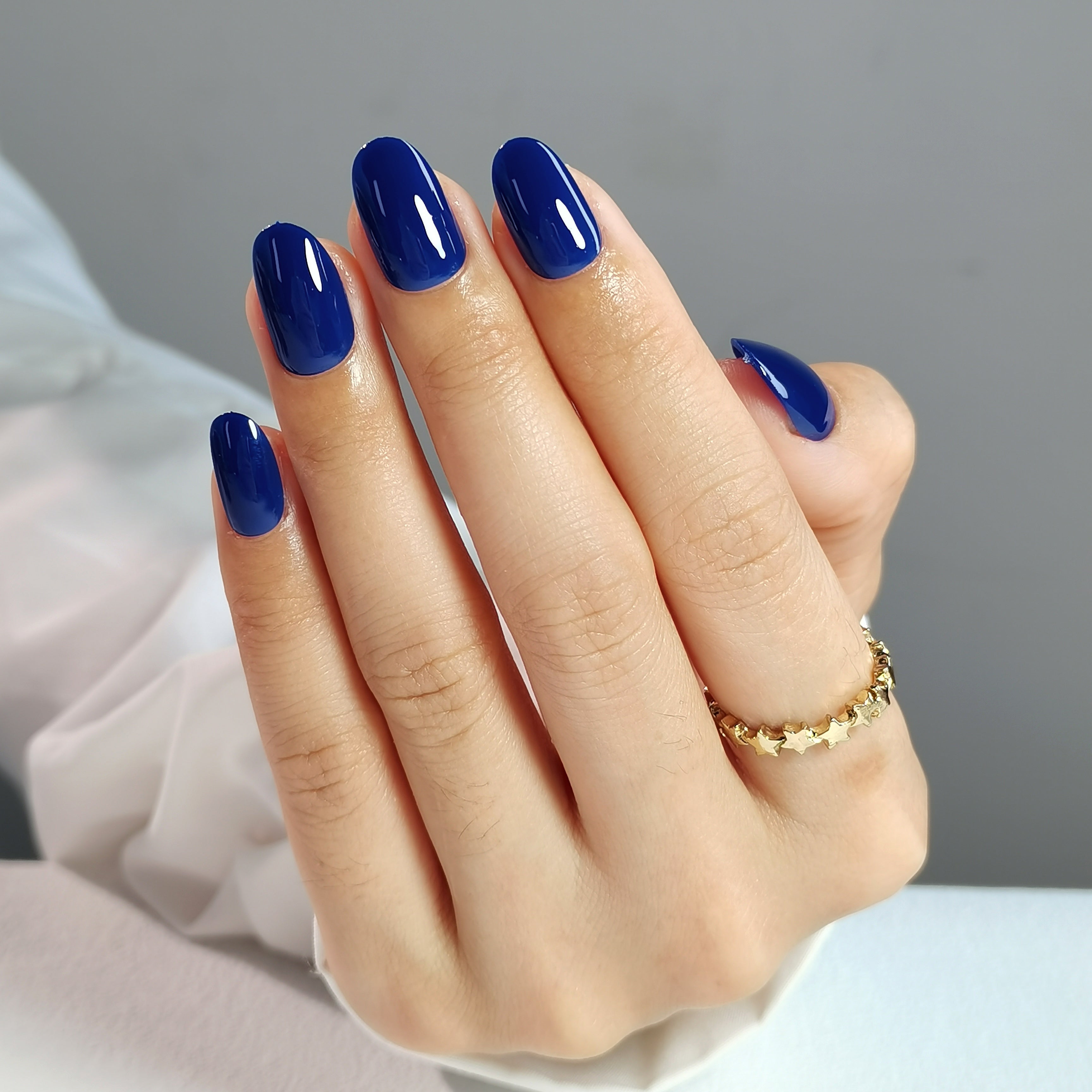 Elegant Deep Blue Nails with Gold