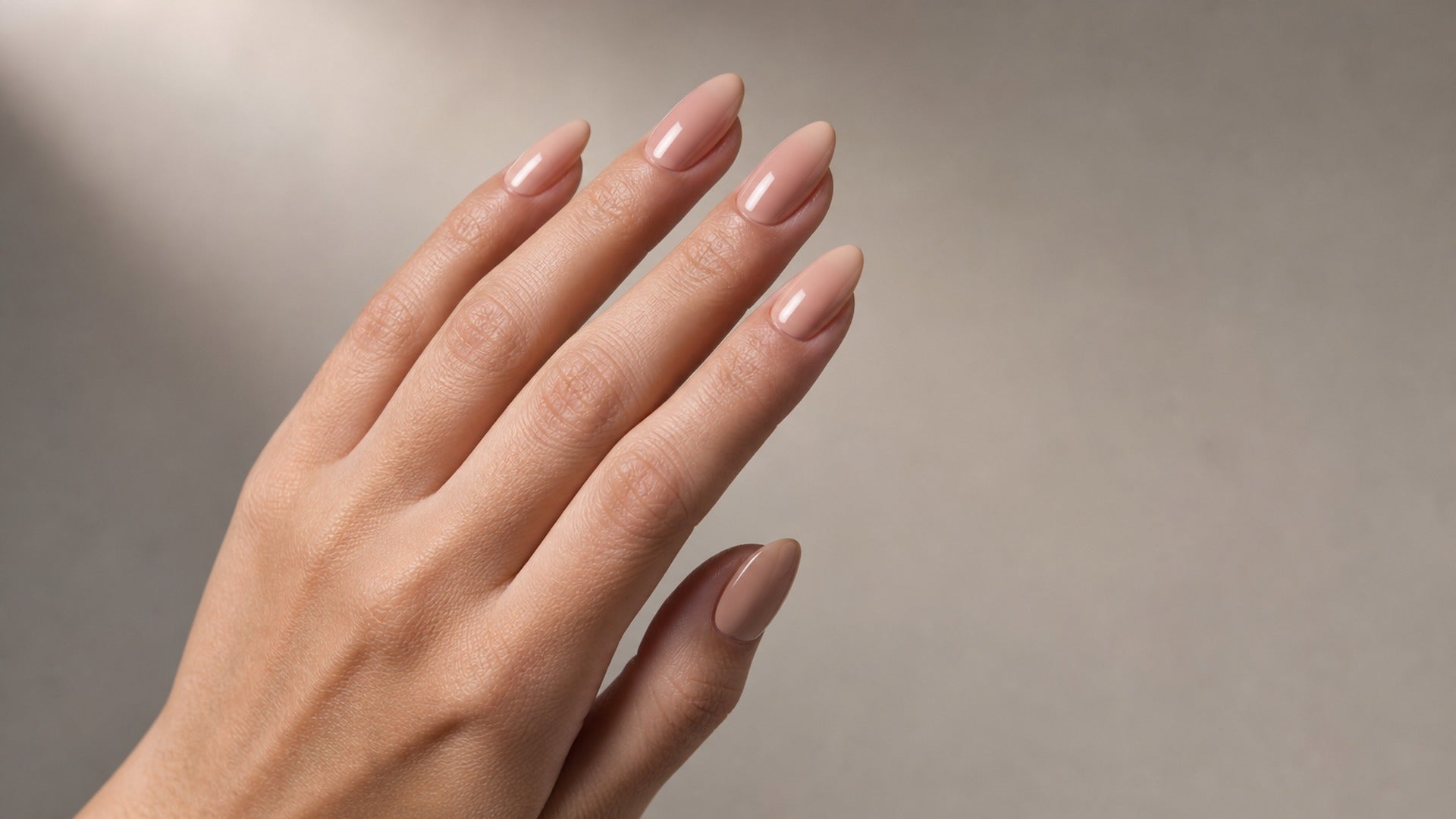 long lasting durable press on nails glossy nude almond editorial hero