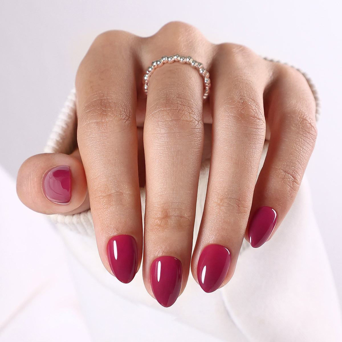 Plum Nocturne Burgundy — Extra Short Almond on hand view | SHANGMENG®