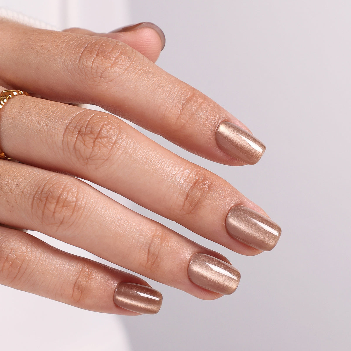 Champagne Halo Beige Cat Eye — Short Square side hand view showing the glossy cat-eye finish | SHANGMENG®