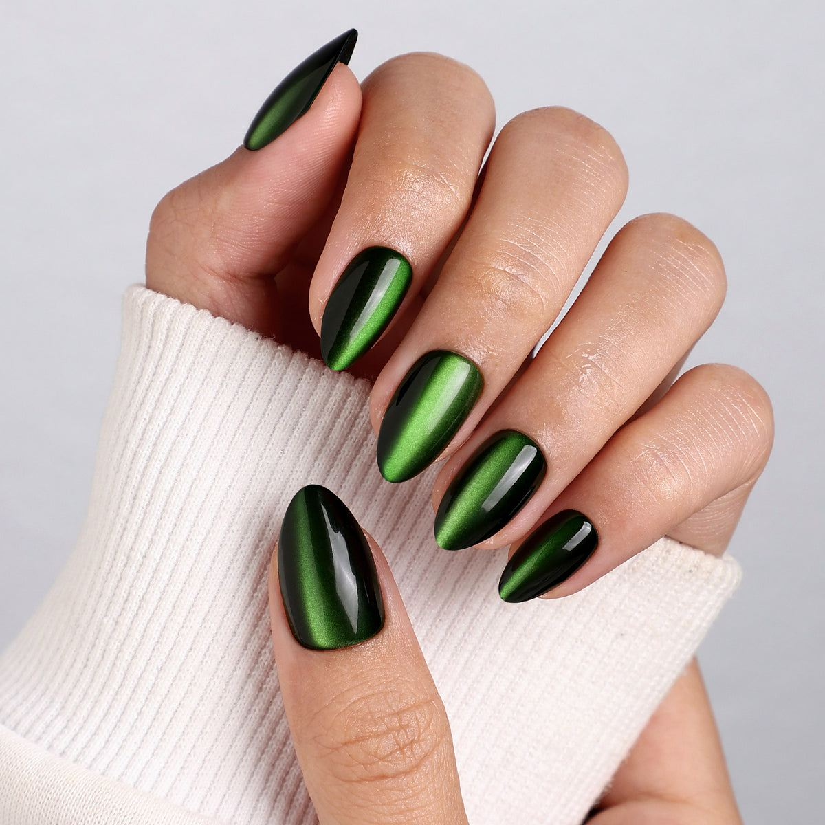 Cat Eye Emerald Green Medium Almond Soft Gel Press-On Nails fan spread detail view one | SHANGMENG®