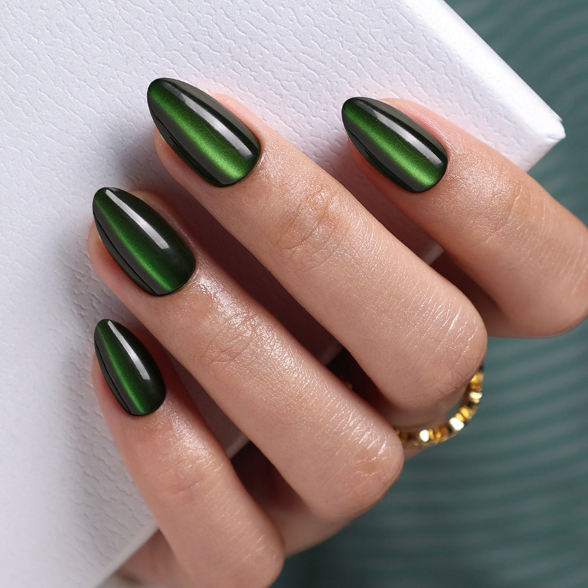 Cat Eye Emerald Green Medium Almond Soft Gel Press-On Nails glossy finish close up on hand | SHANGMENG®