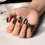 Cat Eye Emerald Green Medium Almond Soft Gel Press-On Nails lifestyle hand with wine glass view | SHANGMENG®