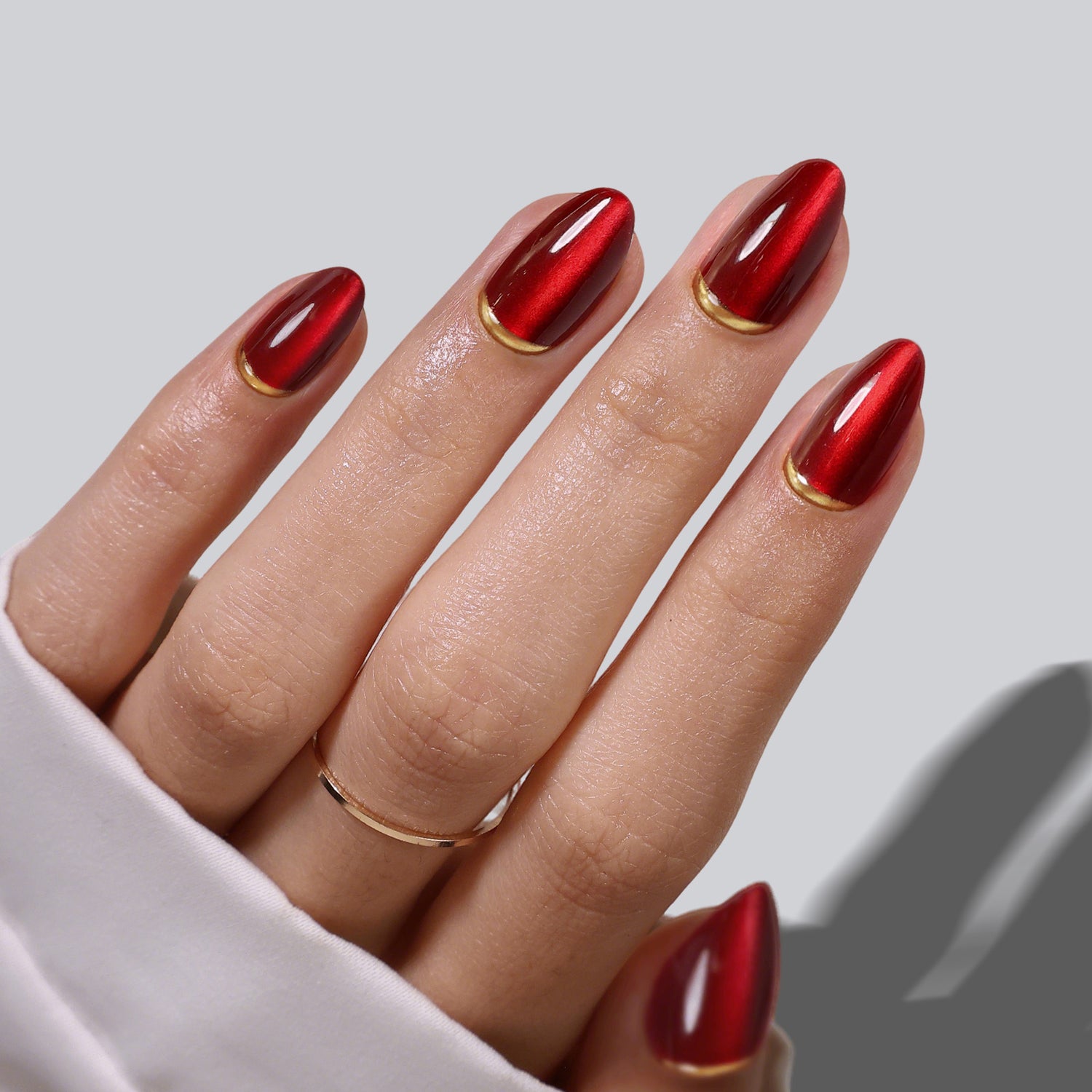 Cat Eye Gold Foil 3D Short Almond Soft Gel Press on Nails product photo on hand | SHANGMENG®