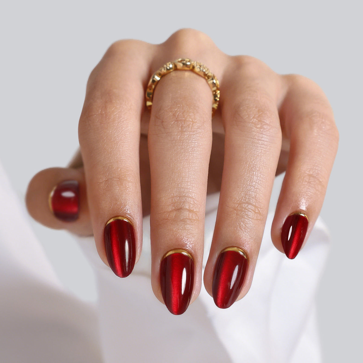 Cat Eye Gold Foil 3D Short Almond Soft Gel Press on Nails on hand angle view | SHANGMENG®