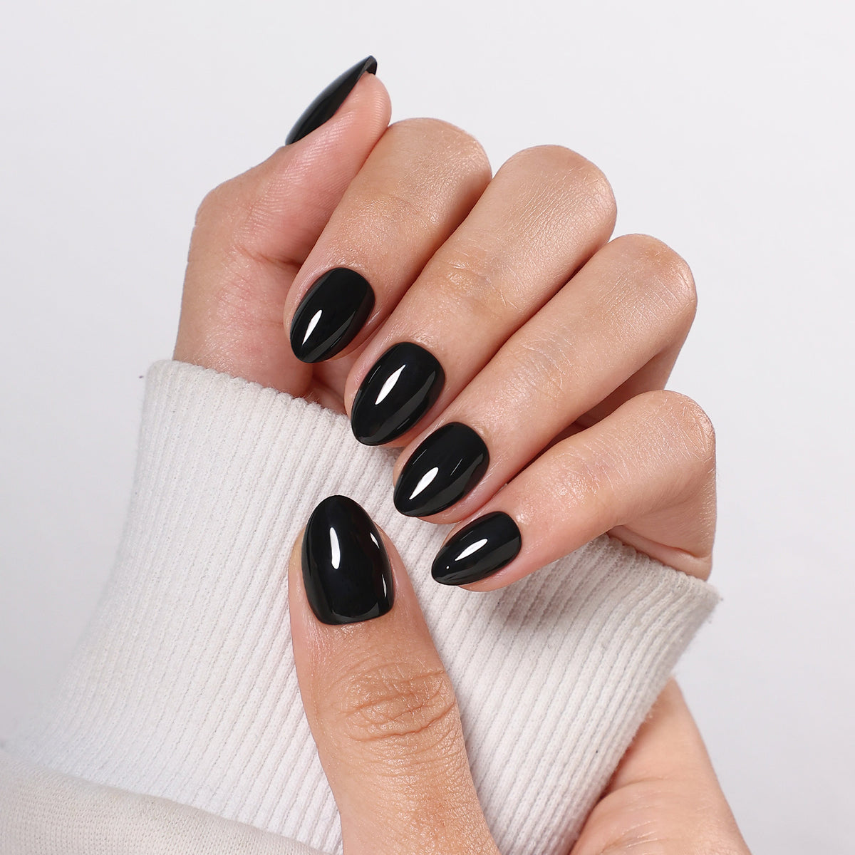 Chic Black High Gloss — Extra Short Almond front hand close-up of glossy black extra short almond nails | SHANGMENG®
