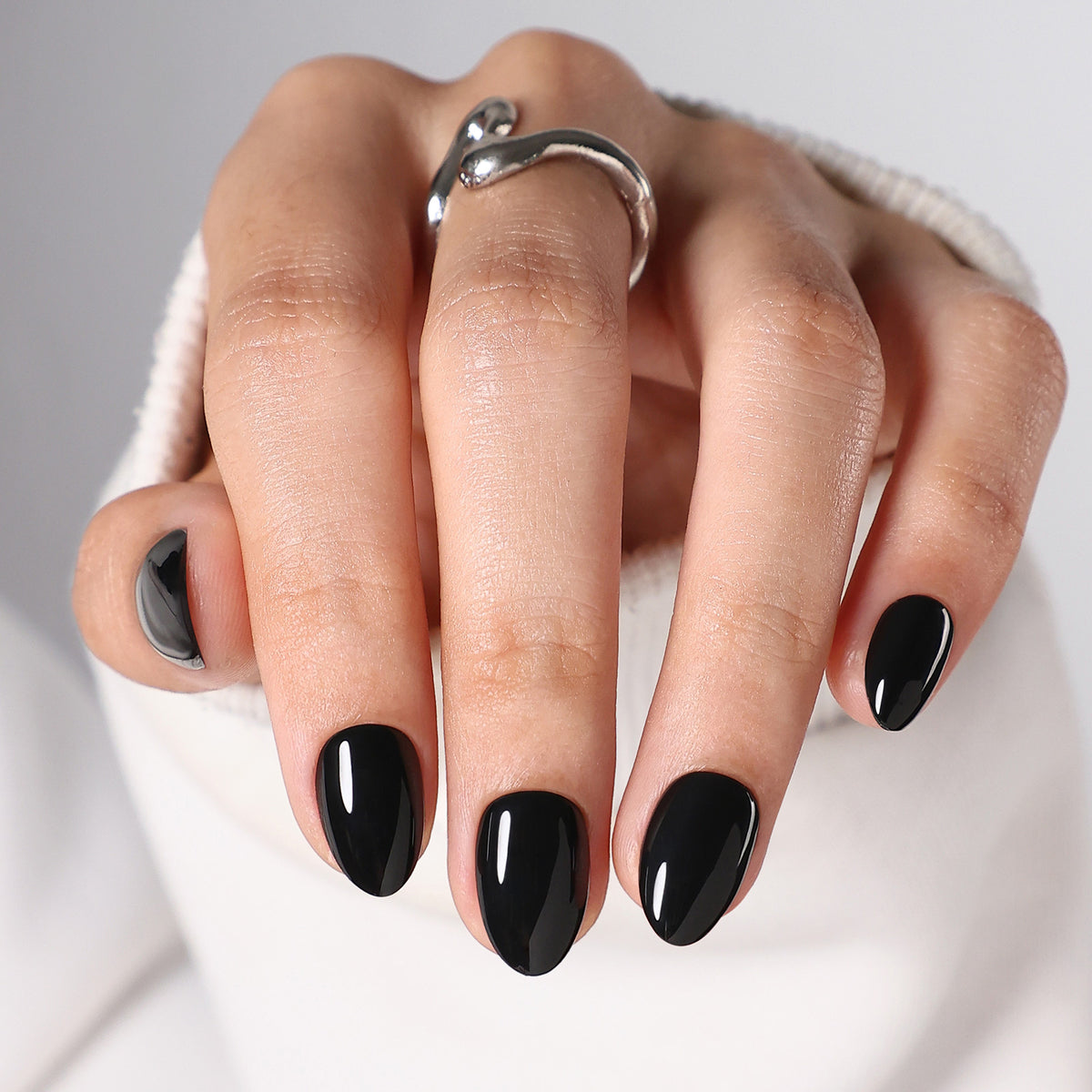 Chic Black High Gloss — Extra Short Almond glossy black extra short almond nails on hand | SHANGMENG®