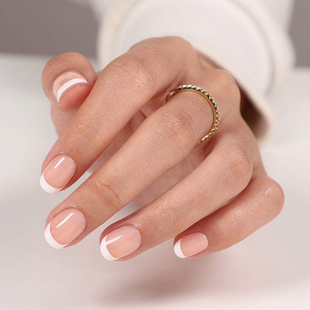 Paris Whisper French Tip — Extra Short Square front hand detail of the classic French extra short round manicure | SHANGMENG®