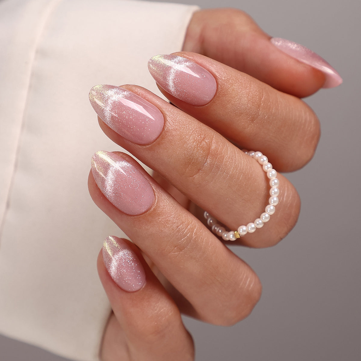 First Kiss Pink Outline Cat Eye Short Almond angled hand view | SHANGMENG