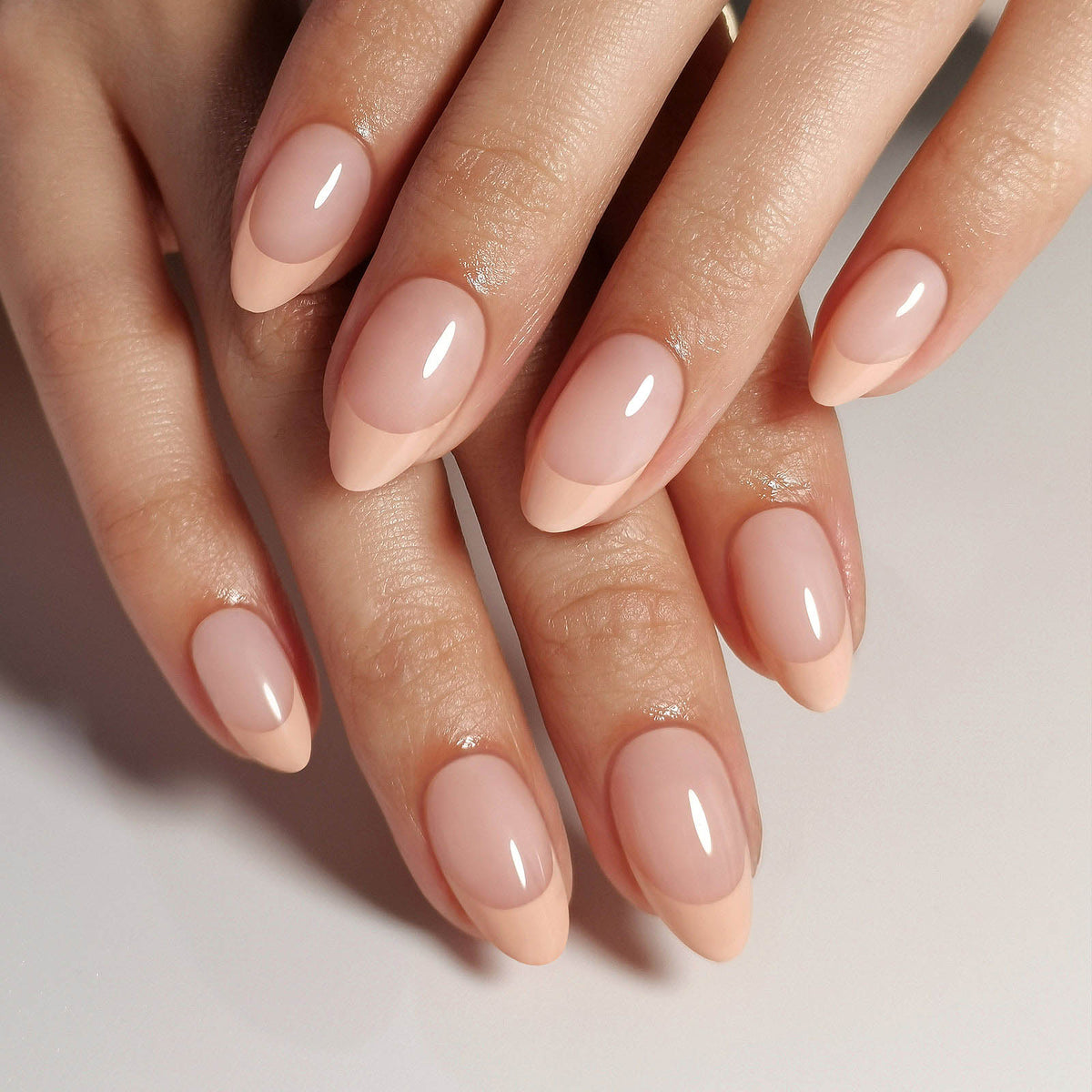 French Nude Almond Reusable Soft Gel Press-On Nails hand model close-up | SHANGMENG®