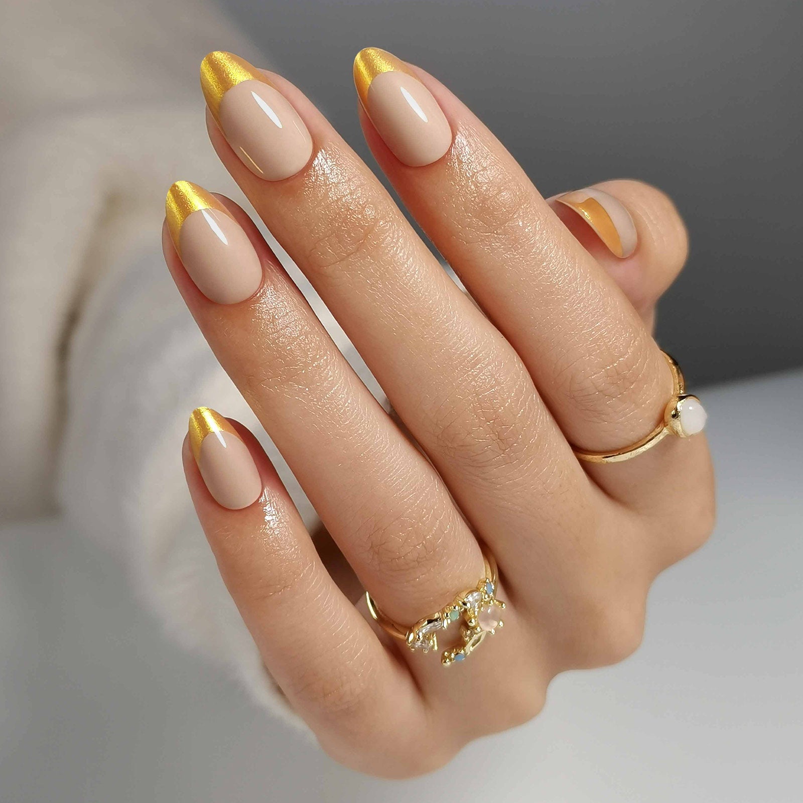 French Nude Gold Almond Reusable Soft Gel Press-On Nails finish close-up on hand | SHANGMENG®