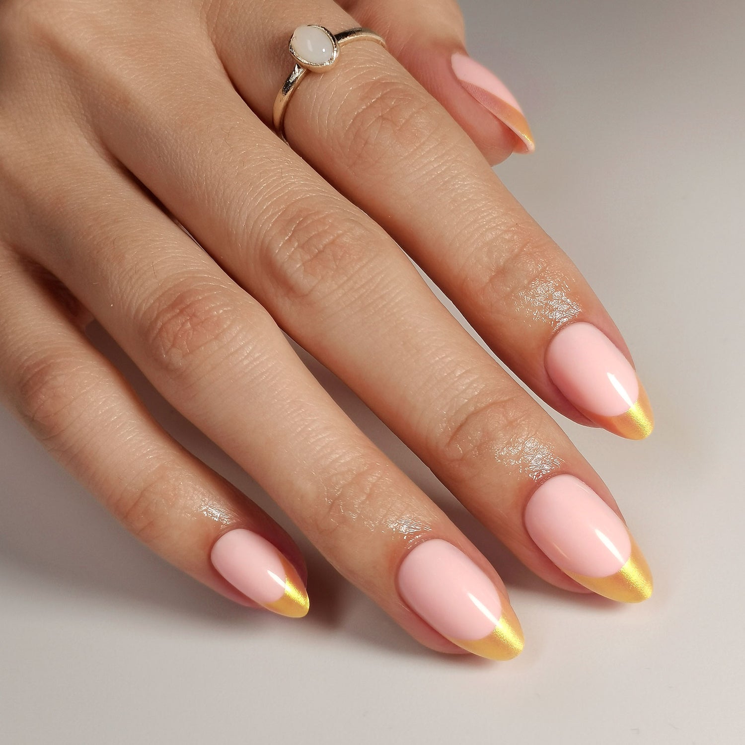 French Pink Gold Almond Reusable Soft Gel Press-On Nails angled hand view | SHANGMENG®