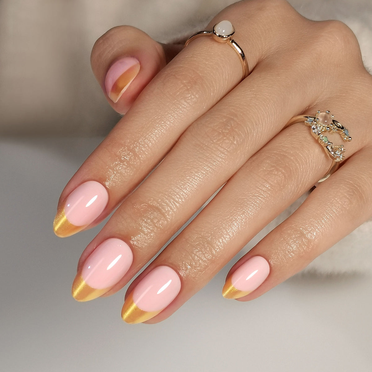 French Pink Gold Almond Reusable Soft Gel Press-On Nails hand model close-up | SHANGMENG®