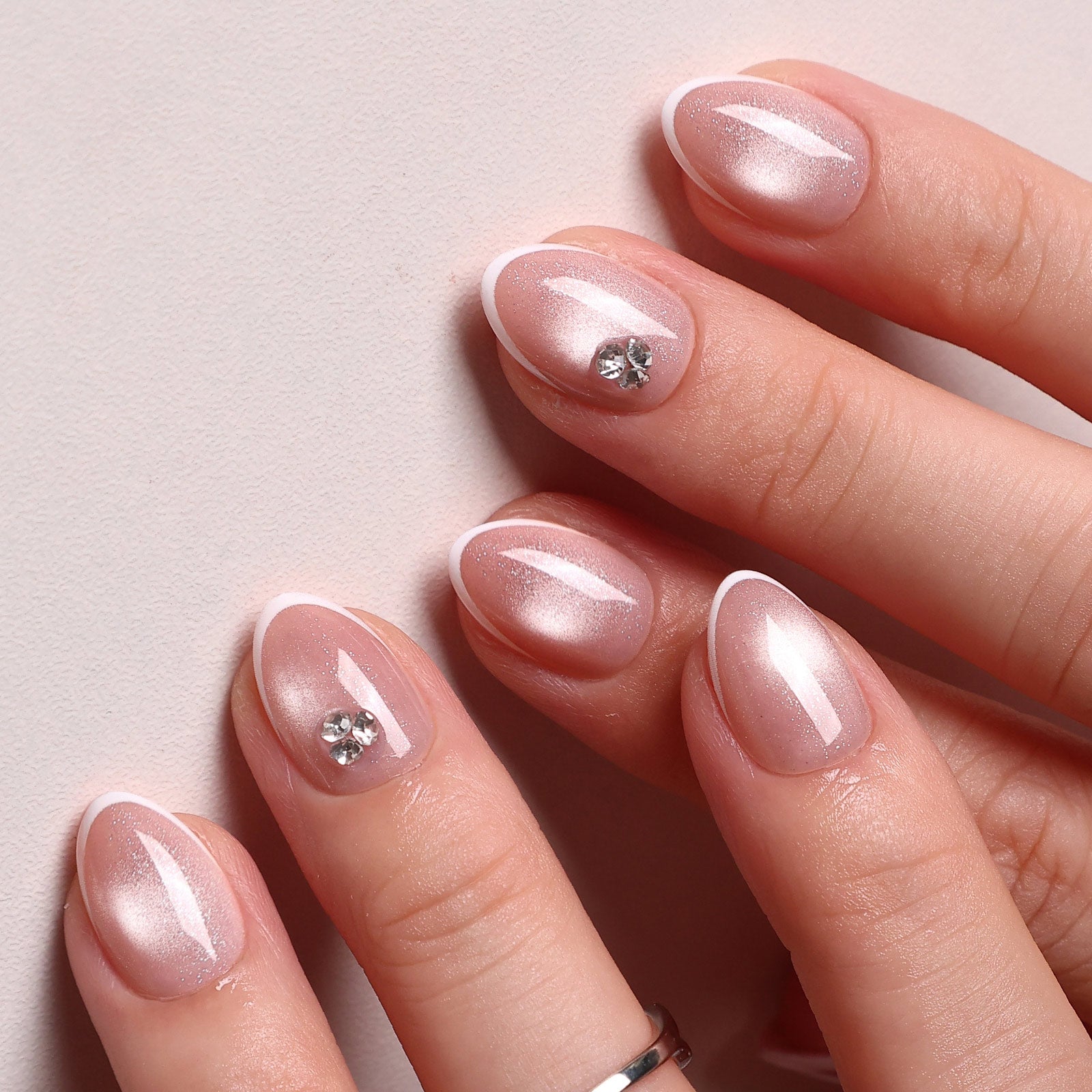 French Tip Cat Eye White Extra Short Almond Press-On Nails angled hand view | SHANGMENG®