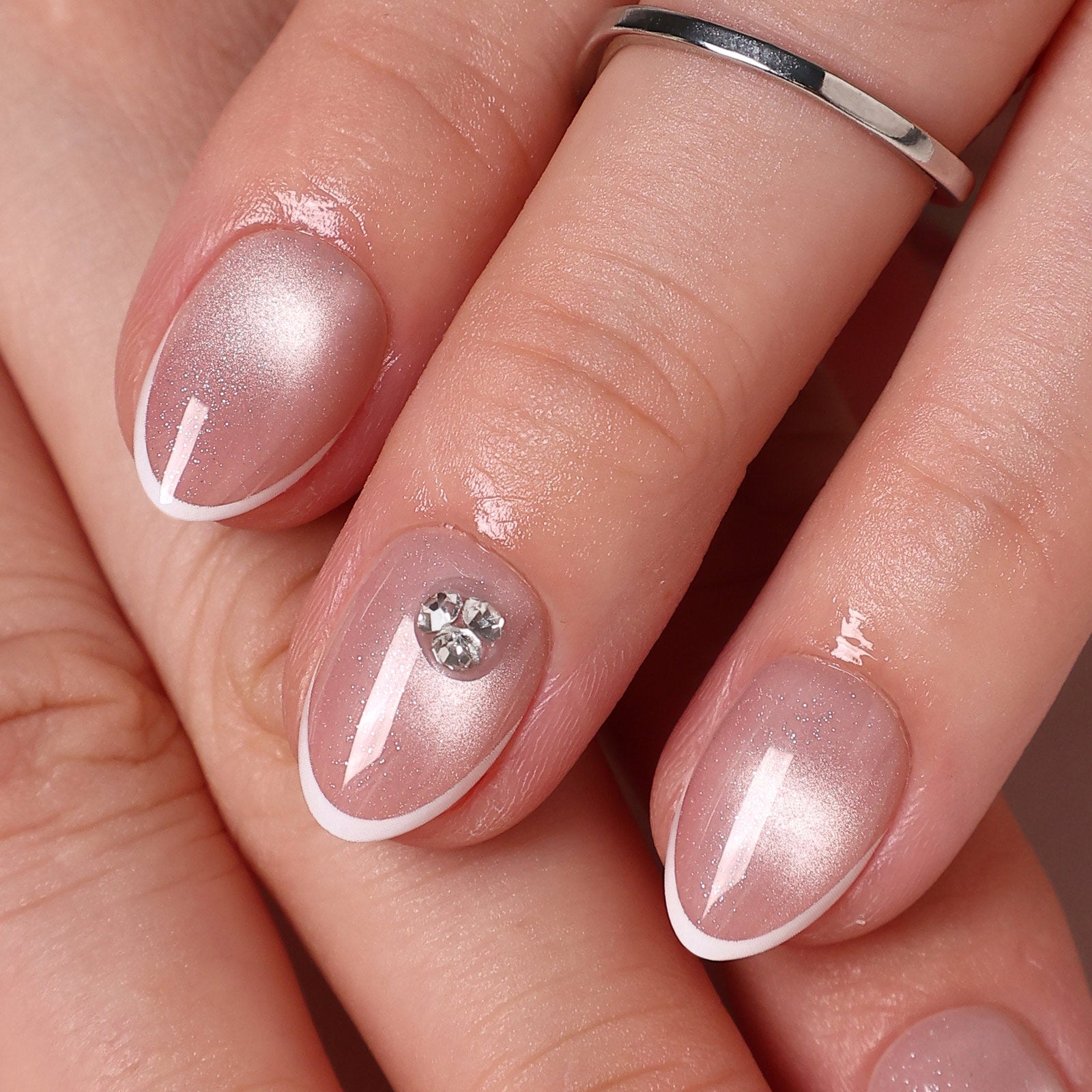 French Tip Cat Eye White Extra Short Almond Press-On Nails finish close-up on hand | SHANGMENG®