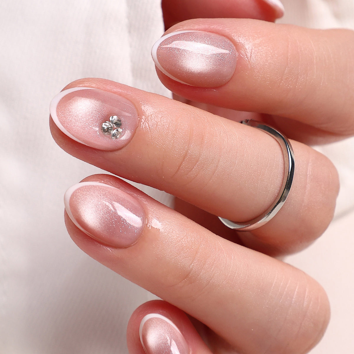 French Tip Cat Eye White Extra Short Almond Press-On Nails main hand model view | SHANGMENG®