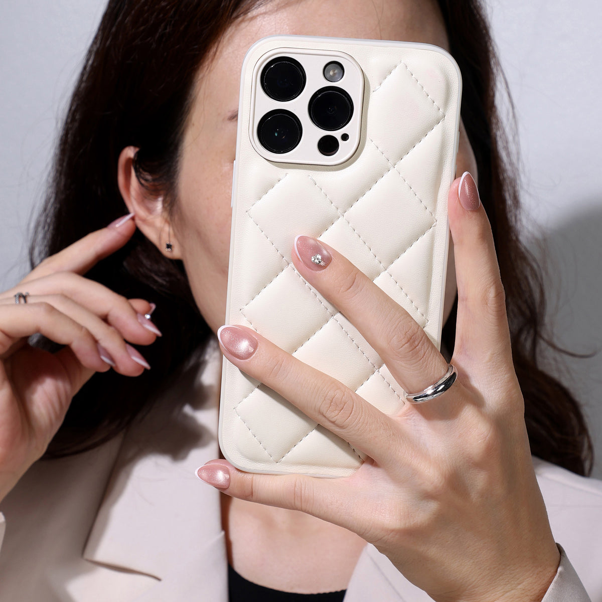 French Tip Cat Eye White Extra Short Almond Press-On Nails lifestyle hand with phone view one | SHANGMENG®