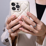 French Tip Cat Eye White Extra Short Almond Press-On Nails lifestyle hand with phone view two | SHANGMENG®