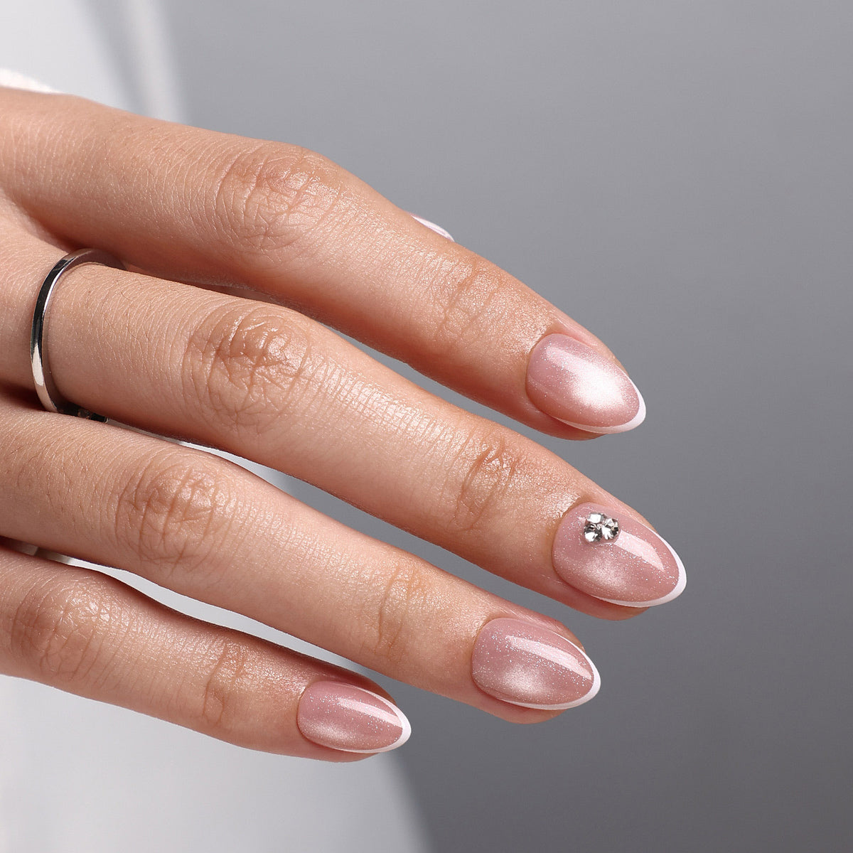 French Tip Cat Eye White Extra Short Almond Press-On Nails rhinestone accent macro view one | SHANGMENG®