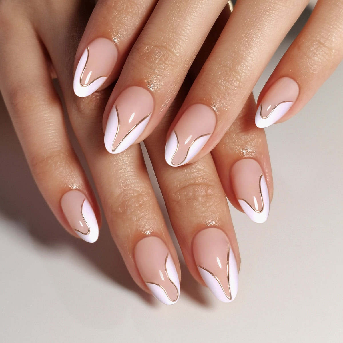 French Tip Gold Almond Reusable Soft Gel Press-On Nails hand model detail | SHANGMENG®