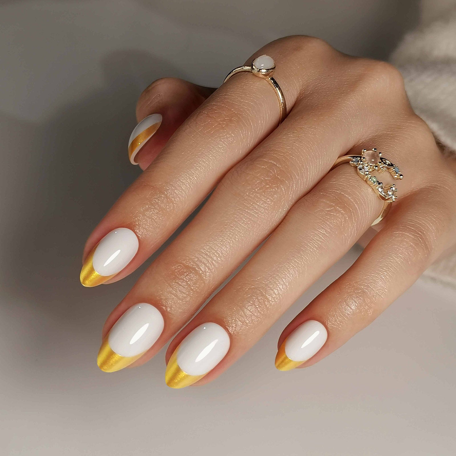 French White Gold Almond Reusable Soft Gel Press-On Nails hand model detail | SHANGMENG®
