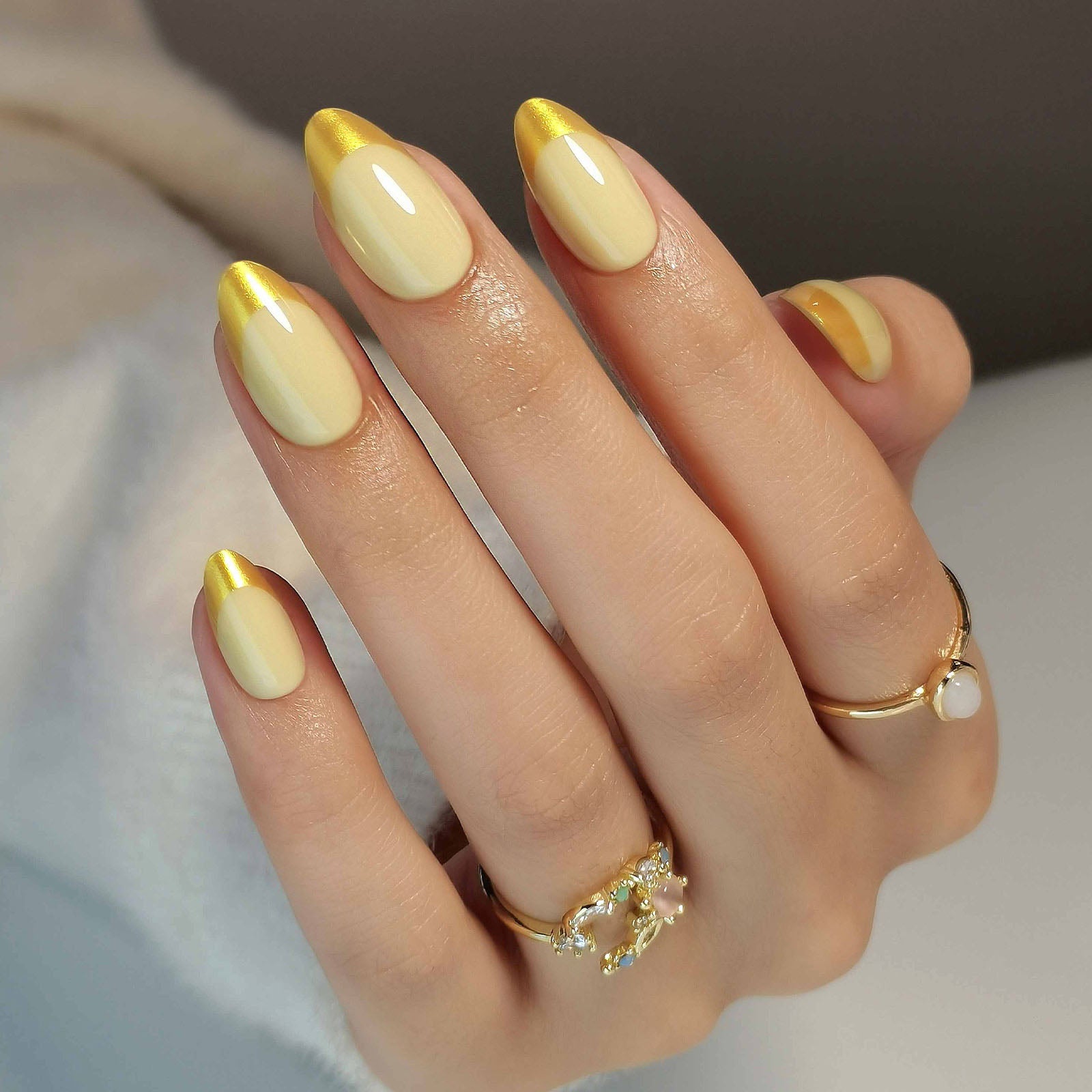 French Yellow Gold Almond Reusable Soft Gel Press-On Nails finish close-up on hand | SHANGMENG®