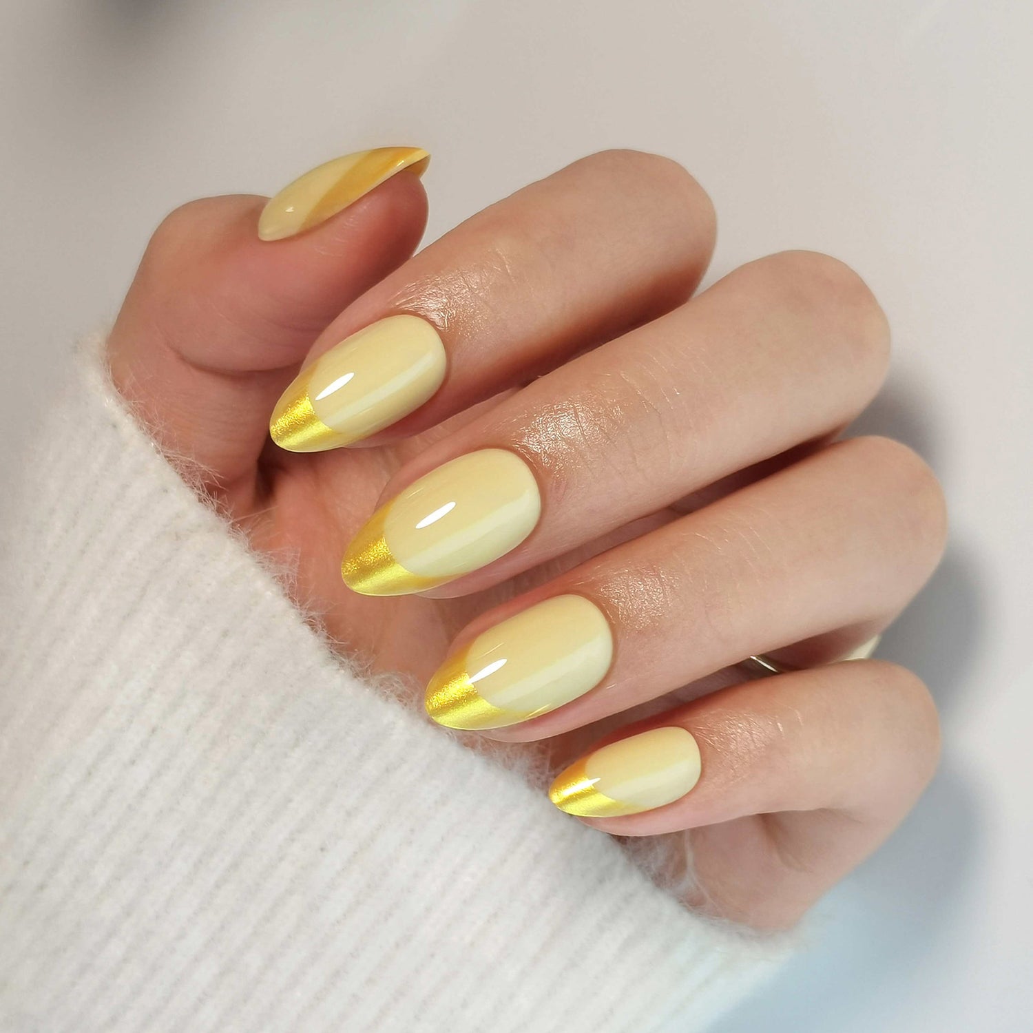 French Yellow Gold Almond Reusable Soft Gel Press-On Nails angled hand view | SHANGMENG®