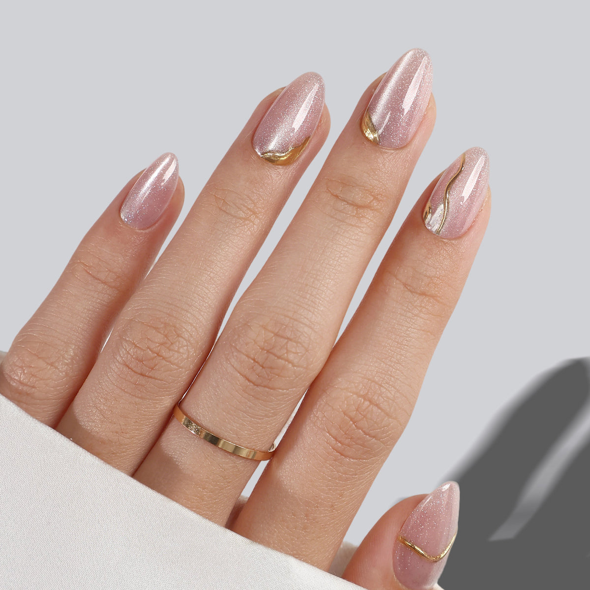 Gilded Glyphs Pink Cat Eye — Short Almond on hand angled view | SHANGMENG®