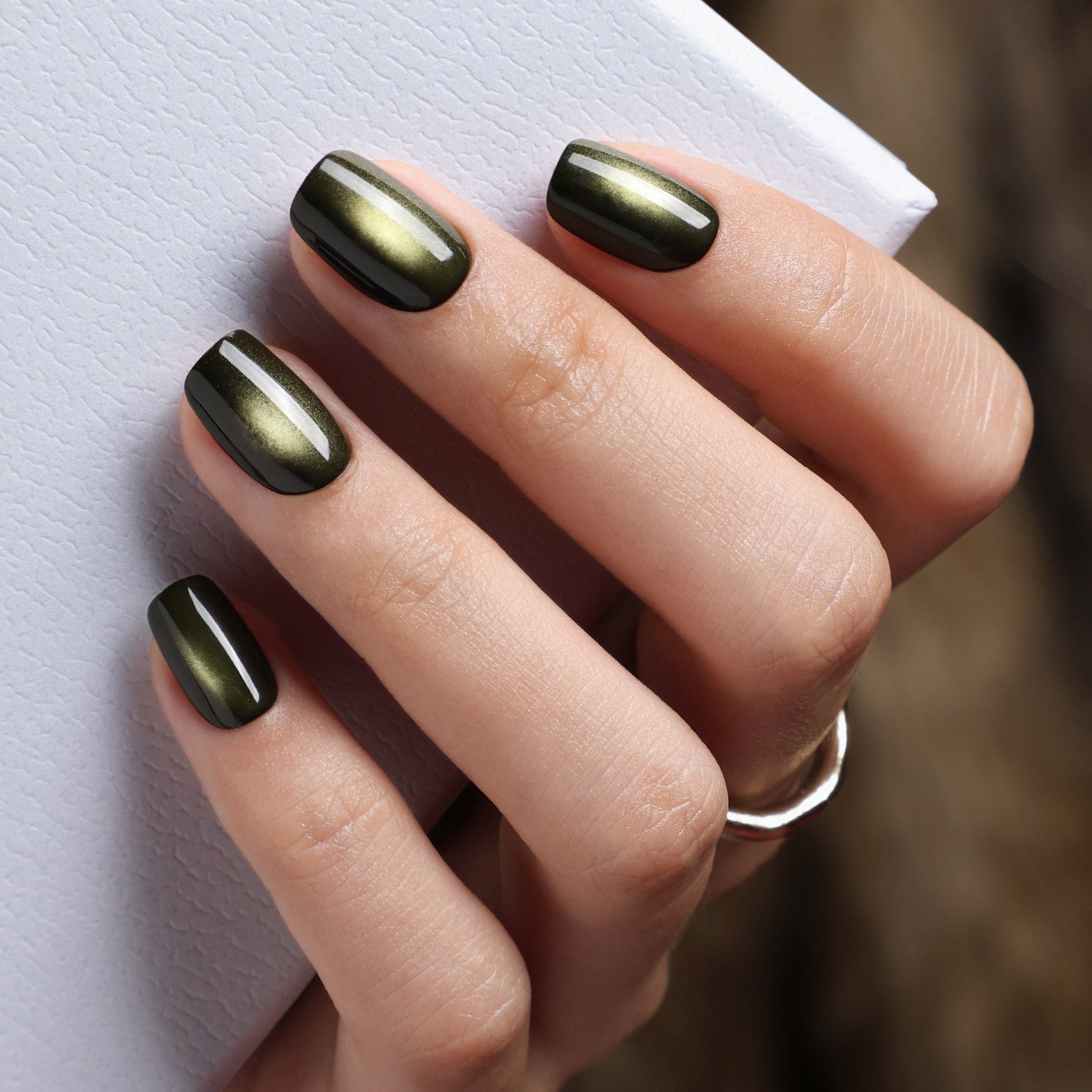Gilded Noir Cat Eye Black Gold Short Square Press-On Nails glossy close-up beside packaging | SHANGMENG®