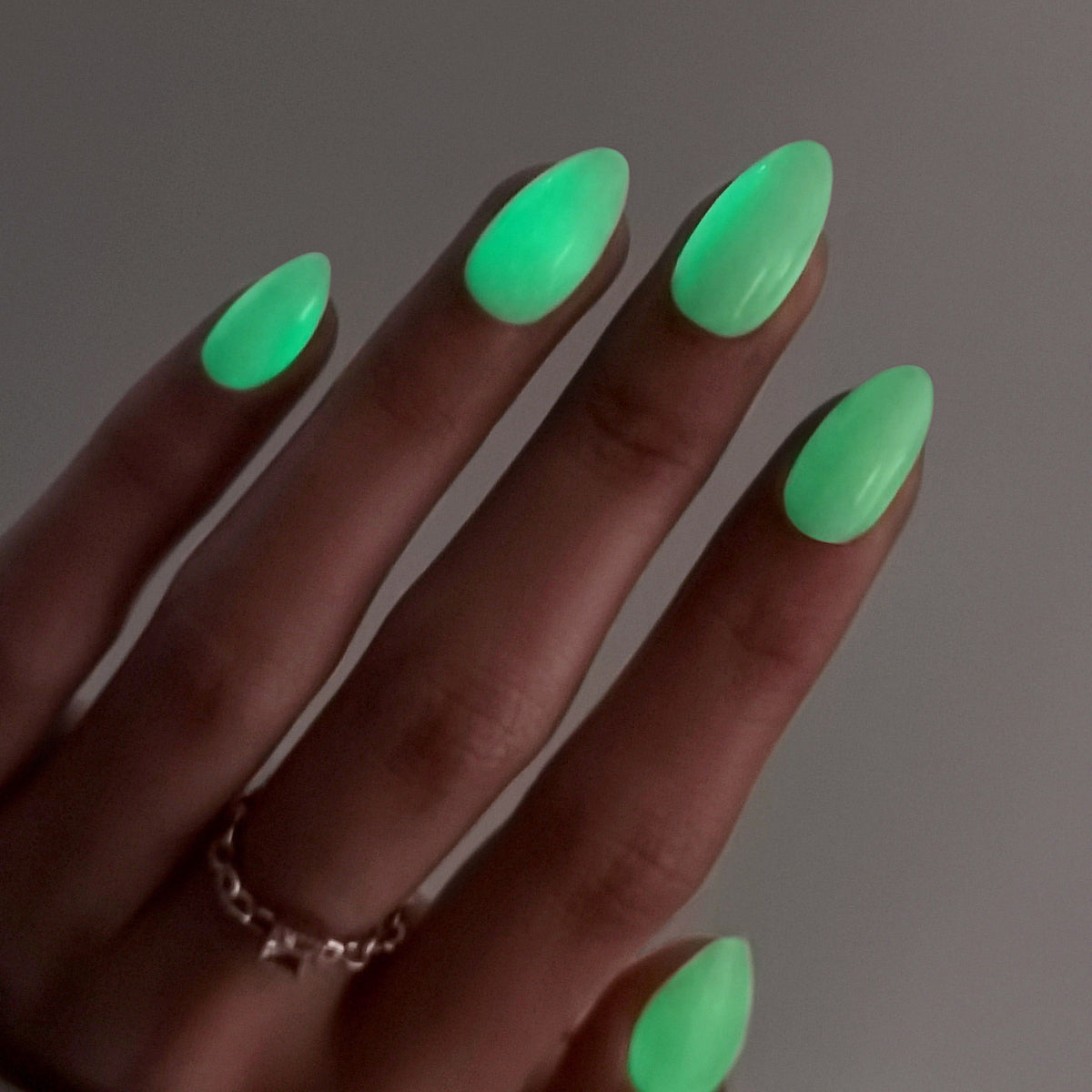 Glow in the Dark Short Almond Soft Gel Press on Nails on hand angle view glow effect | SHANGMENG®