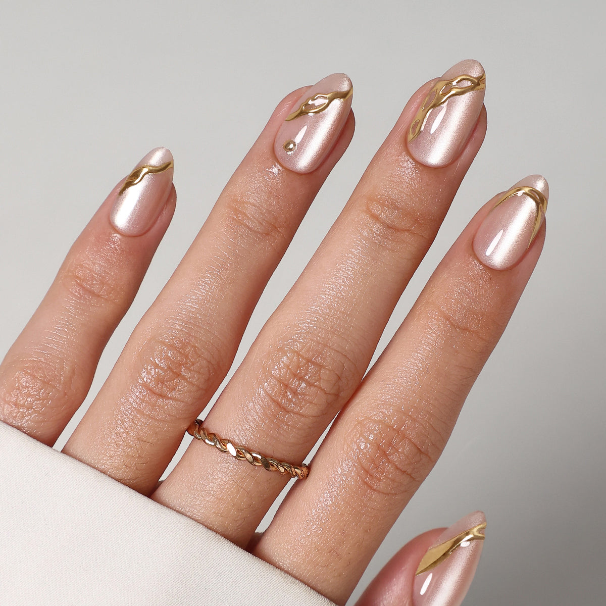 Gold Carving Cat Eye 3D Short Almond Press-On Nails angled hand view | SHANGMENG®