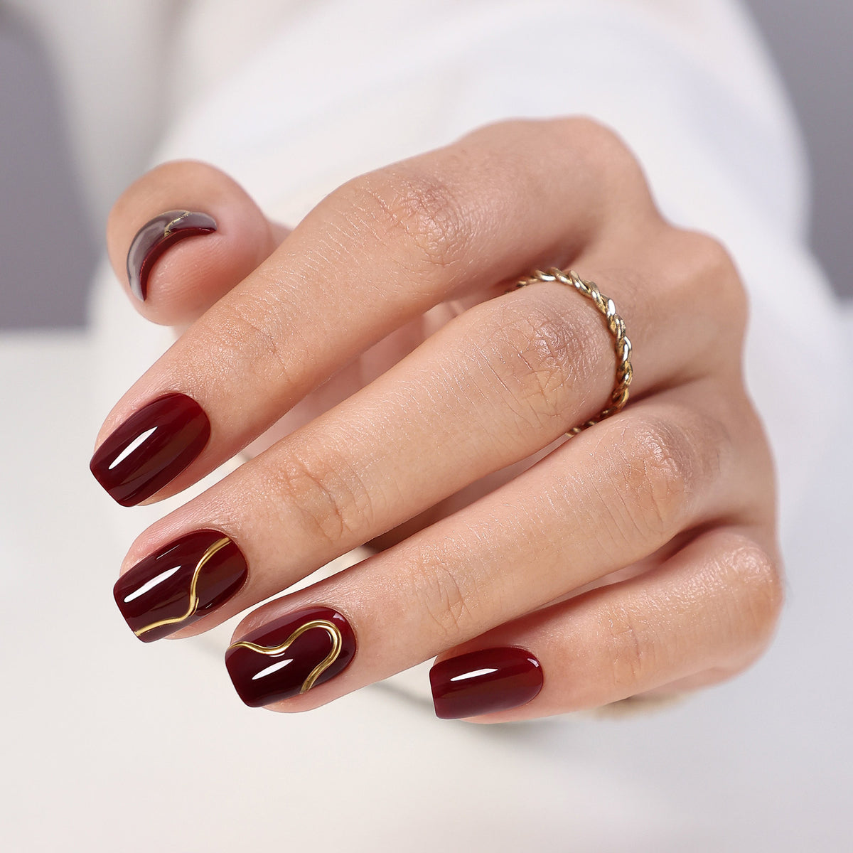 Gilded Ember Red Gold Swirl — Short Square finish close-up on hand | SHANGMENG®