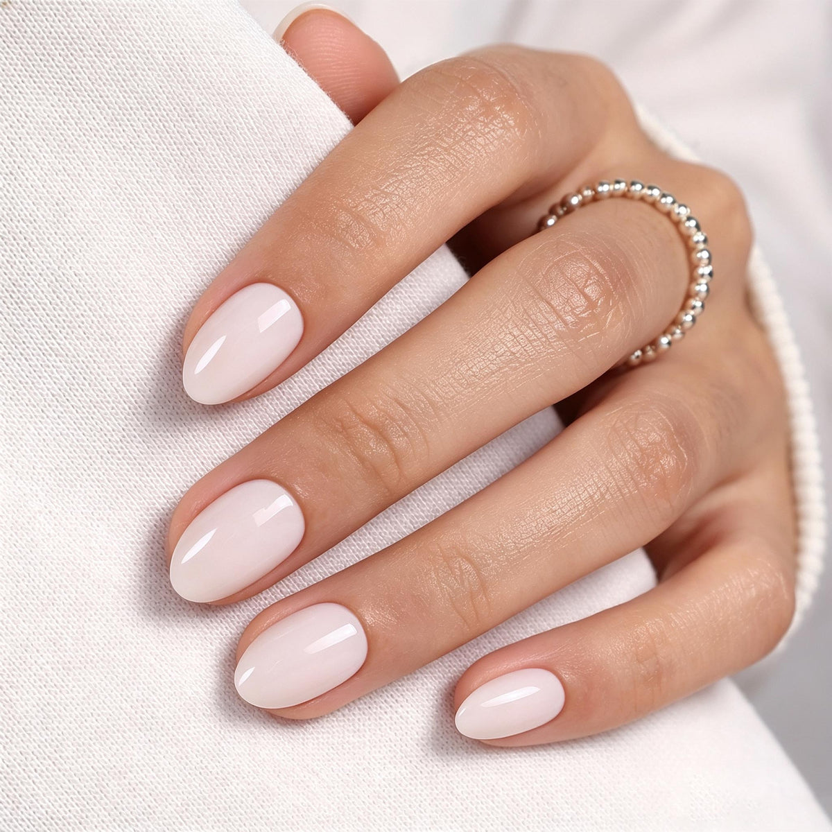 Milk Glass Milky White — Extra Short Almond front hand detail of the milky white extra short almond manicure | SHANGMENG®