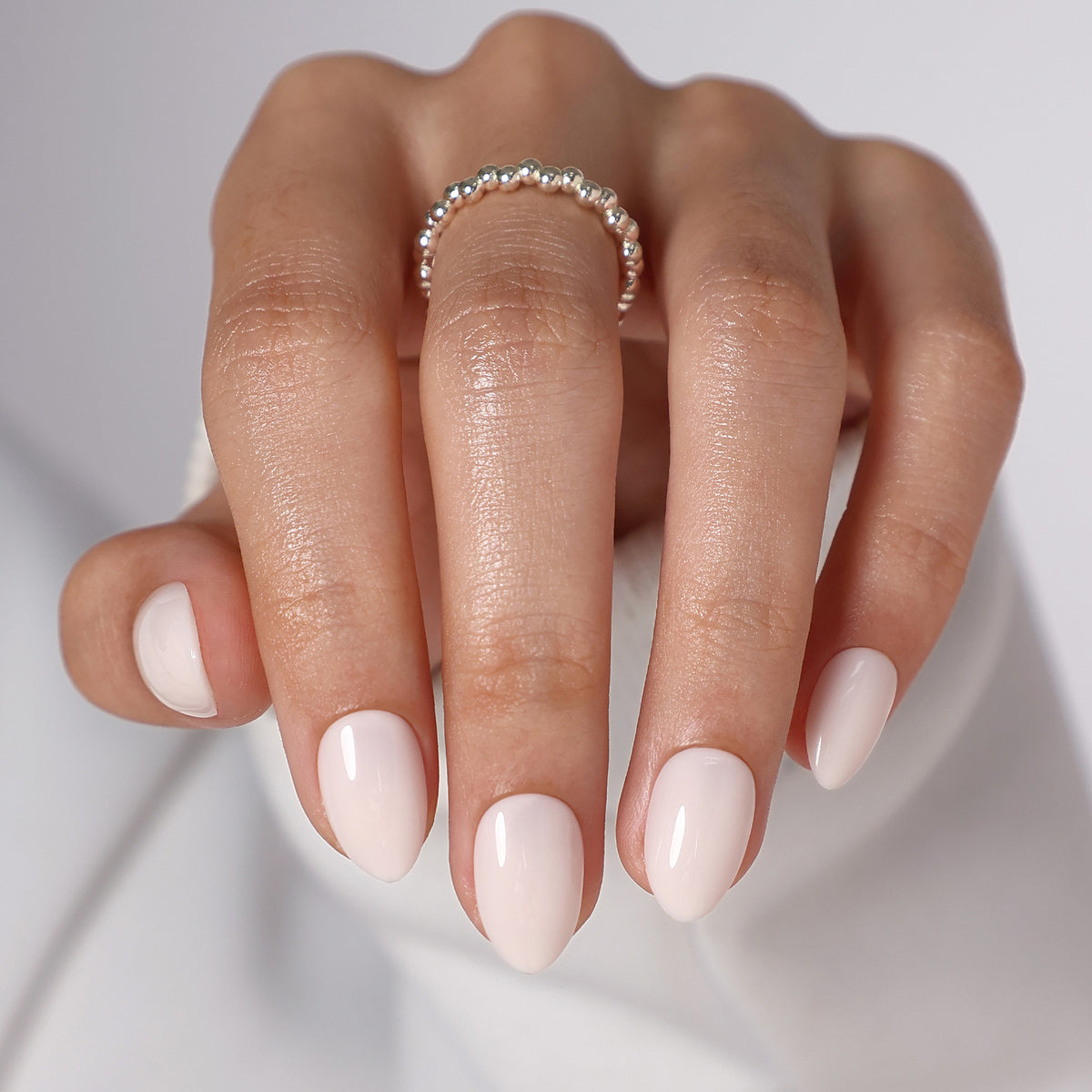 Milk Glass Milky White — Extra Short Almond front hand main view of the milky white extra short almond manicure | SHANGMENG®