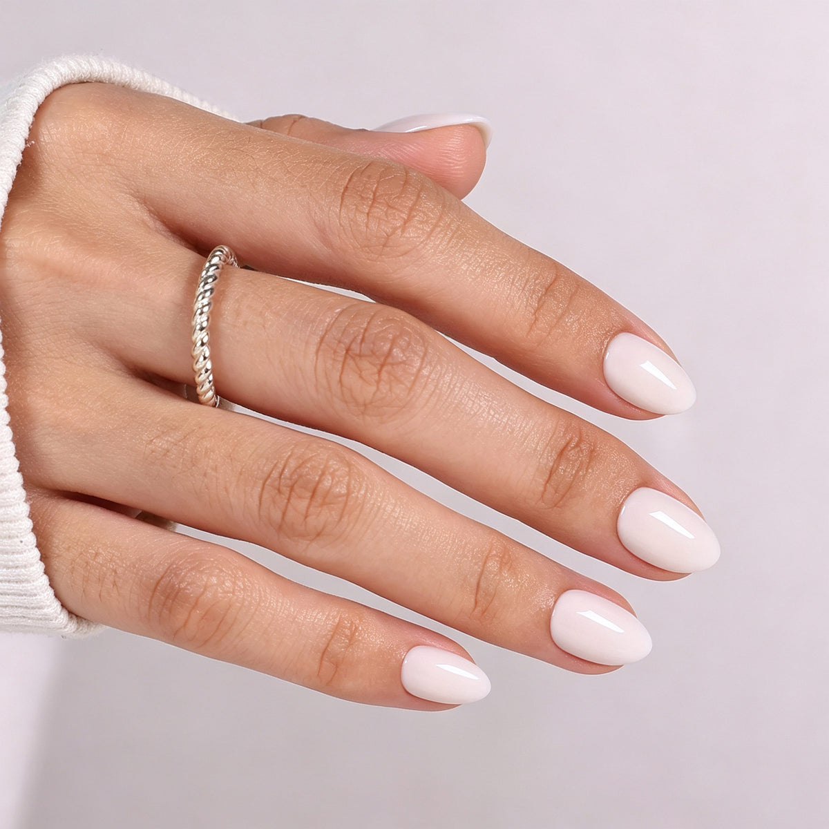 Milk Glass Milky White — Extra Short Almond side hand finish view of the milky white extra short almond manicure | SHANGMENG®
