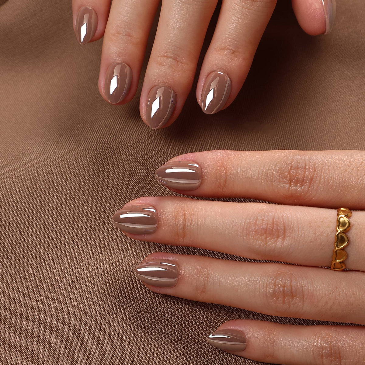 Mocha Mirage Chrome — Extra Short Almond two hands on brown fabric | SHANGMENG®