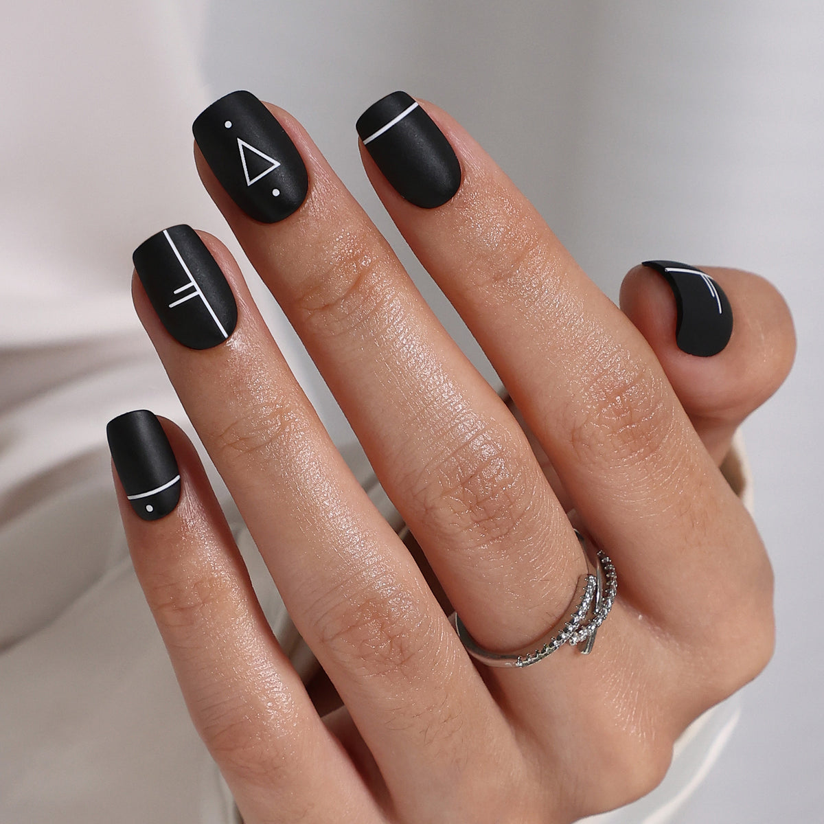 Op Art Mini Matte Black Short Square Press-On Nails angled hand view | SHANGMENG®