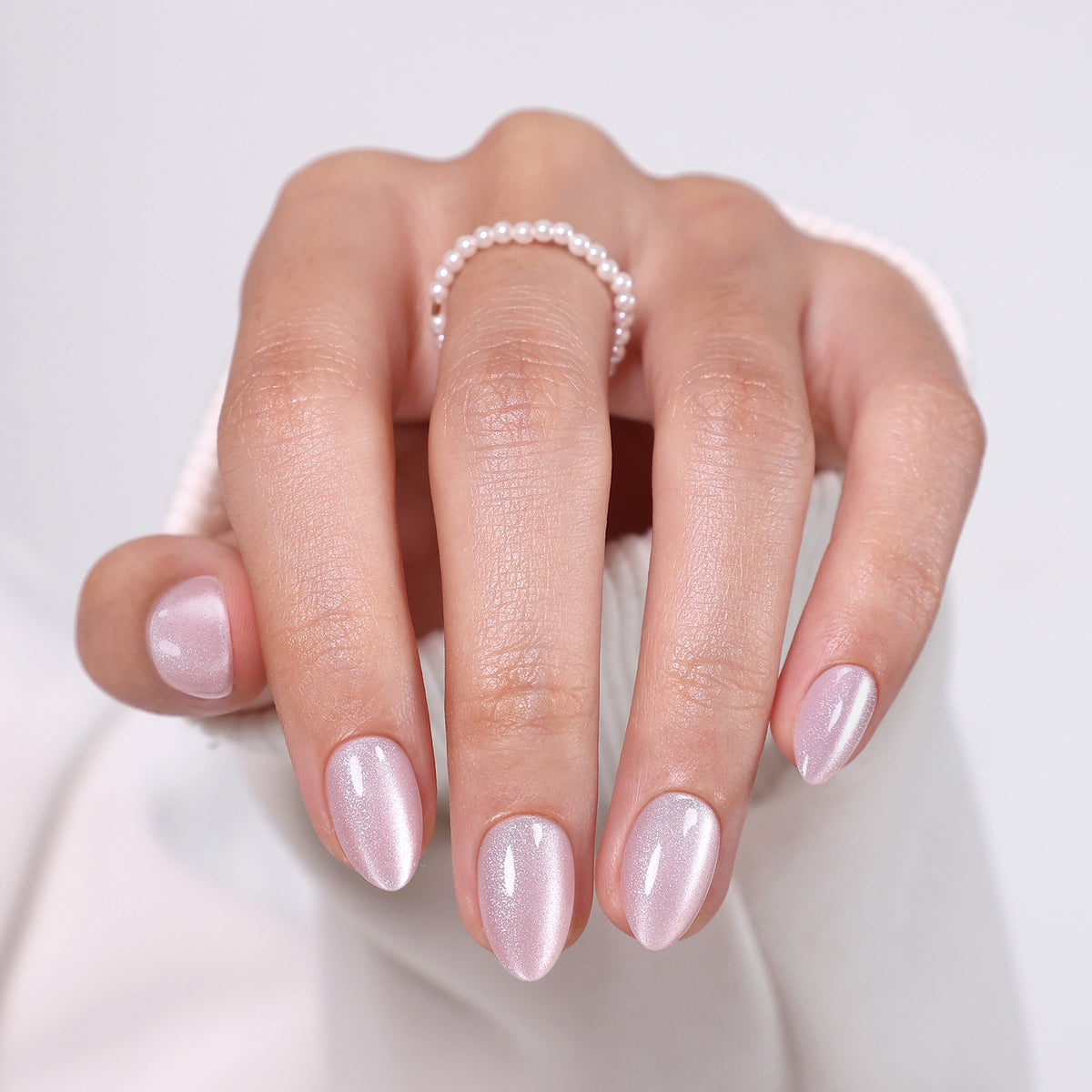 Pearl Blush Cat Eye — Extra Short Almond angled hand close-up of the cat eye shimmer | SHANGMENG®