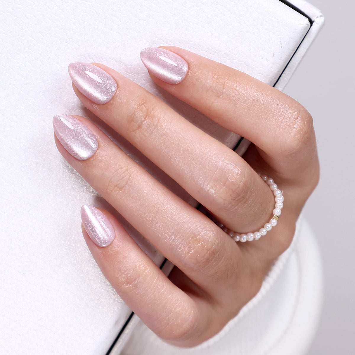 Pearl Blush Cat Eye — Extra Short Almond finish close-up on hand | SHANGMENG®
