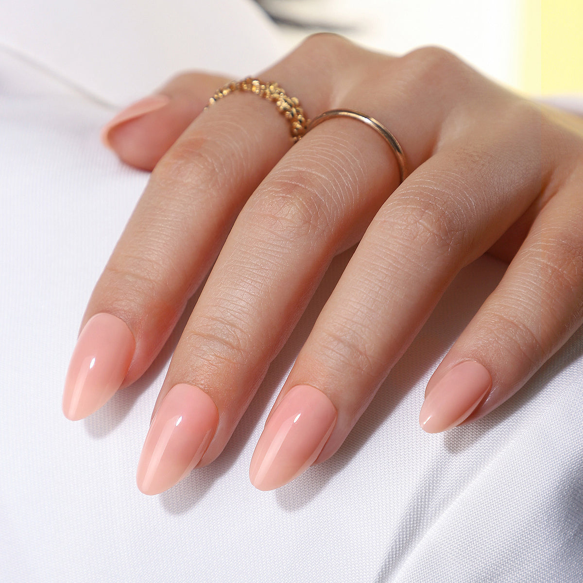 Pink Nude Short Almond Reusable Soft Gel Press-On Nails finish close-up on hand | SHANGMENG®