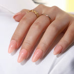 Pink Nude Short Almond Reusable Soft Gel Press-On Nails finish close-up on hand | SHANGMENG®