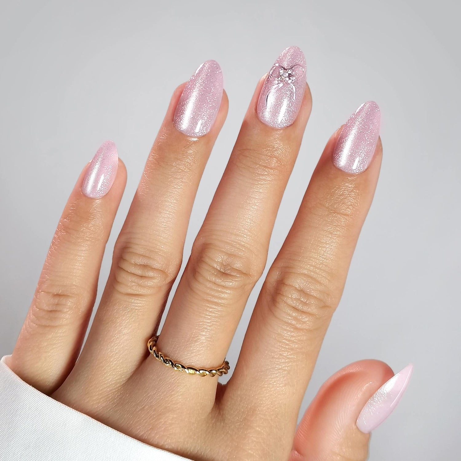 Pink Cat Eye Almond Nails With 3d Silver Bow