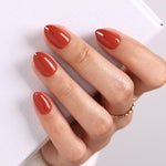 Autumn Ember Brown Gloss — Extra Short Almond angled hand view of the reddish brown extra short almond manicure | SHANGMENG®