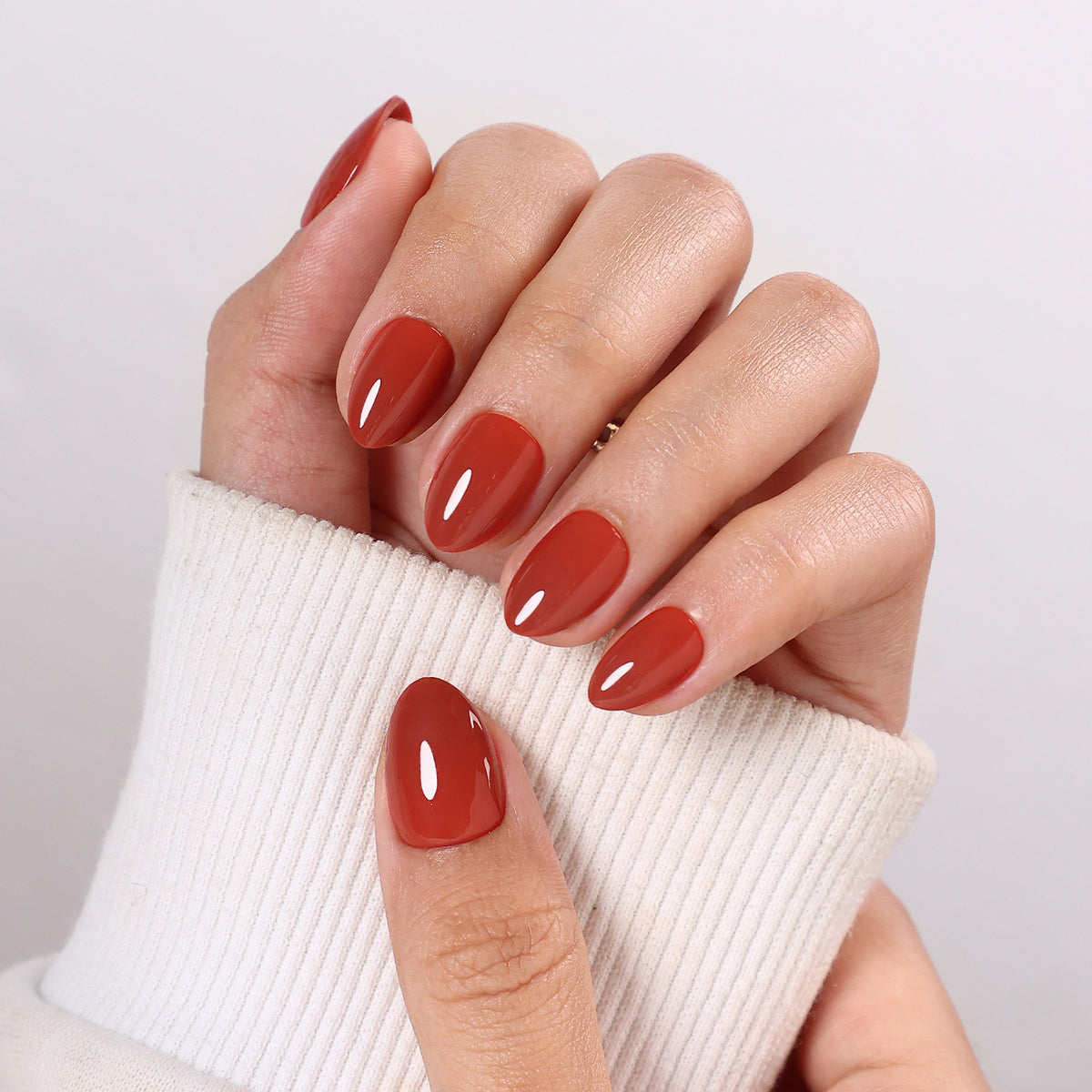 Autumn Ember Brown Gloss — Extra Short Almond on hand view | SHANGMENG®