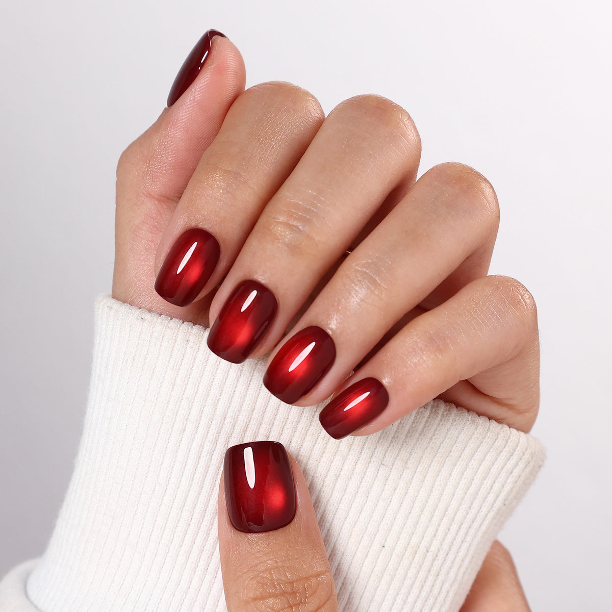 Ruby Halo Wine Cat Eye — Short Square sweater cuff hand view of the ruby halo cat-eye wine short square manicure | SHANGMENG®