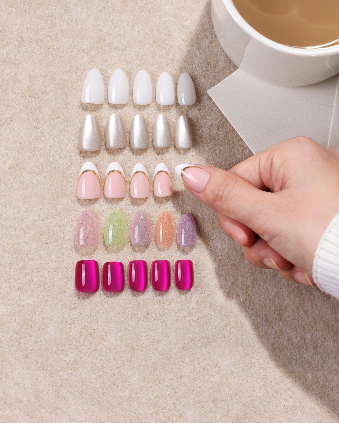 Five weekday press-on nail looks with a hand selecting a style