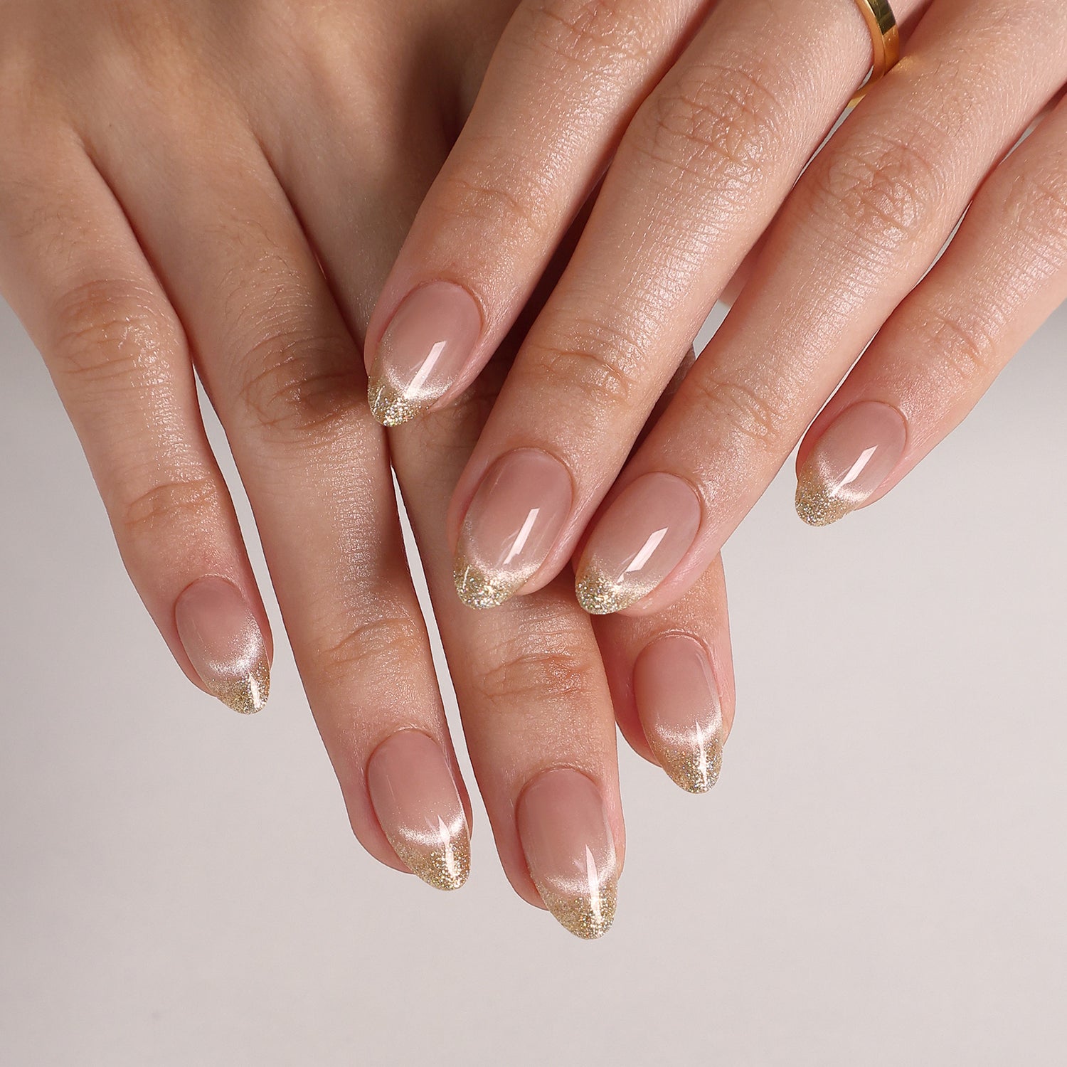 Smile & Shine French Cat Eye Short Almond Press-On Nails angled hand view | SHANGMENG®