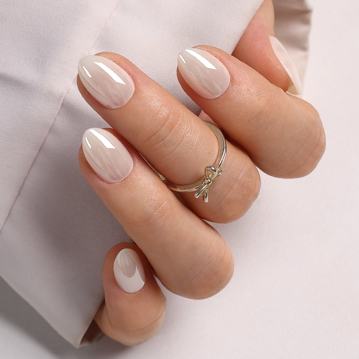 White Mirror Chrome Extra Short Almond Press-On Nails alternate hand angle on silk | SHANGMENG®
