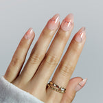 Silver futuristic ombre pink 3D almond press-on nails worn on hand